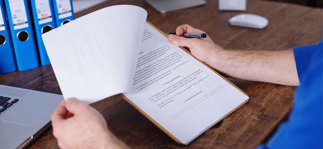 What is Vendor Management Explained by a Contract in a Man's Hand